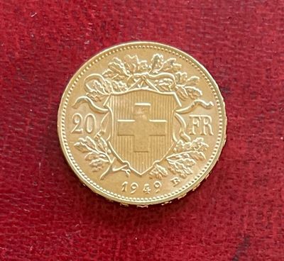 l'image d'une pièce d'or sur laquelle figurent des armoiries