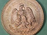 an image of a coin with an eagle on it on a green surface