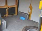 a yellow van that is parked in a garage