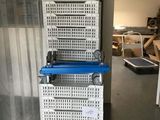 a stack of baskets sitting on top of each other in a room