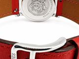 an image of a wrist watch with a red leather band and a silver buckle