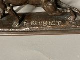 a bronze statue of a horse and a rider on a horse