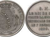a close up of a coin with a crown on top of it