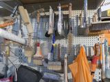 many different tools hanging on the wall in the store
