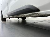 a close up of a car ' s exhaust pipe on the ground