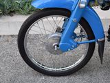 a blue motorcycle parked on the side of the road