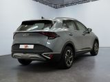 the rear end of a silver car in a white room