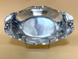 a silver plate that is sitting on a table
