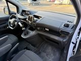 the interior of a small car with a steering wheel and dashboard