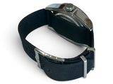 a black watch with a silver buckle on a black strap