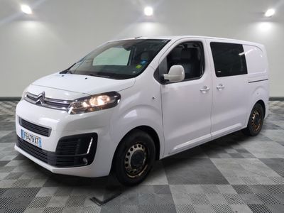 the white van is parked on a checkered tile floor