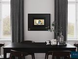 a picture of a dining room with a black table and chairs