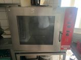 a microwave that is sitting on a stand in a kitchen