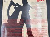 the back cover of a record with a silhouette of a man and a woman dancing