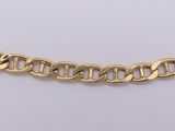 a close up of a gold chain necklace on a white background