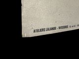 a sign on the door of a building that says atelier ' s lamee, wisconsin, usa