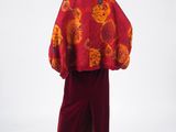 an image of a mannequin dressed in a red and orange outfit