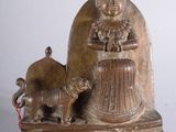 statue of a woman with a dog and a cat on a table