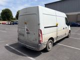 a white van that is parked in a parking lot