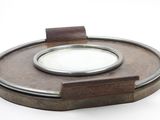 a small round mirror sitting on top of a wooden box