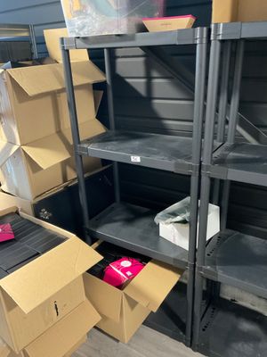 many boxes and boxes on the shelves in the room