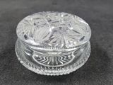 a small glass box with a lid on a table