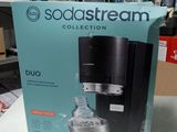 boxed sodastream coffee maker in box on table in store