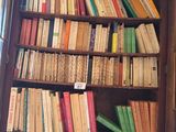 a book case with many books on the shelves