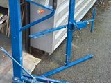 a blue lifter sitting on the side of a building