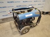 a small blue machine that is sitting on the ground