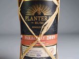 an image of a bottle of wine wrapped in twine