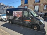 a van that is parked on the side of the street