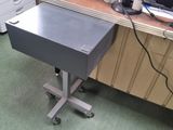 a desk with a computer and a printer on it