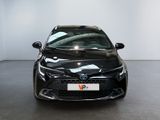 the front view of a black toyota corollant parked in a room