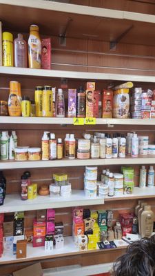 a woman standing in front of a shelf full of food