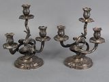pair of silver plated candlesticks with birds and flowers on them