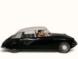 disney figurine mickey mouse in a black car with a white top