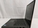 the back of a laptop computer sitting on top of a white table