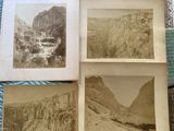 four old black and white photographs of a mountain landscape