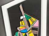 an image of a picture of a piece of art that is in a white frame