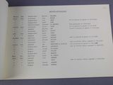 an open book with a bunch of numbers on it sitting on a table