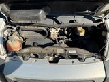 the engine of a car with its hood open and the hood down