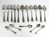 a lot of silver spoons and spoon spoons on a table