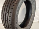 a close up of a tire on a white surface