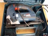 a blue tool box with a drill and other tools in it
