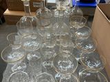 a lot of empty glasses on a table in a room