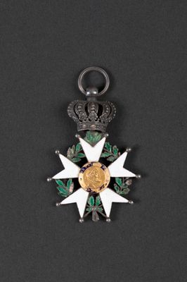 a close up of a medal on a black surface