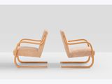 pair of lounge chairs designed by the architect of the 1960s