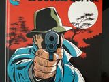 la couverture d'une bande dessinée représentant un homme tenant un pistolet