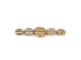 a close up of a gold plated hair clip with a yellow stone